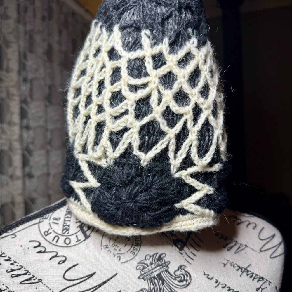 Black and White Knitted Hat with Intricate Lace Pattern